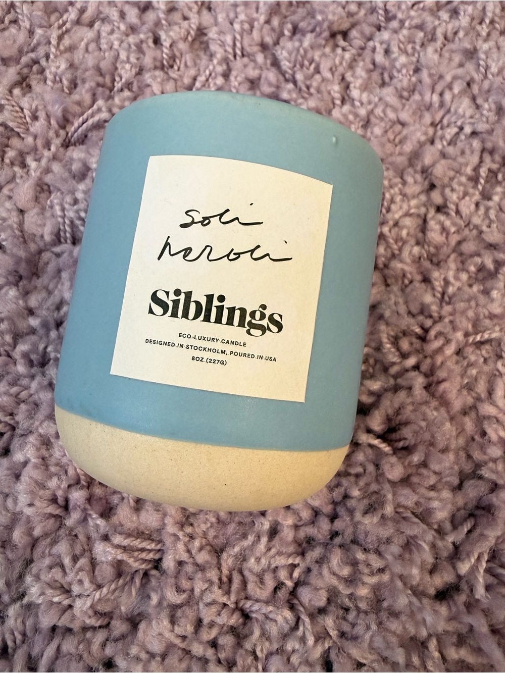 Noli Seroli siblings candle in blue and cream Ceramic jar